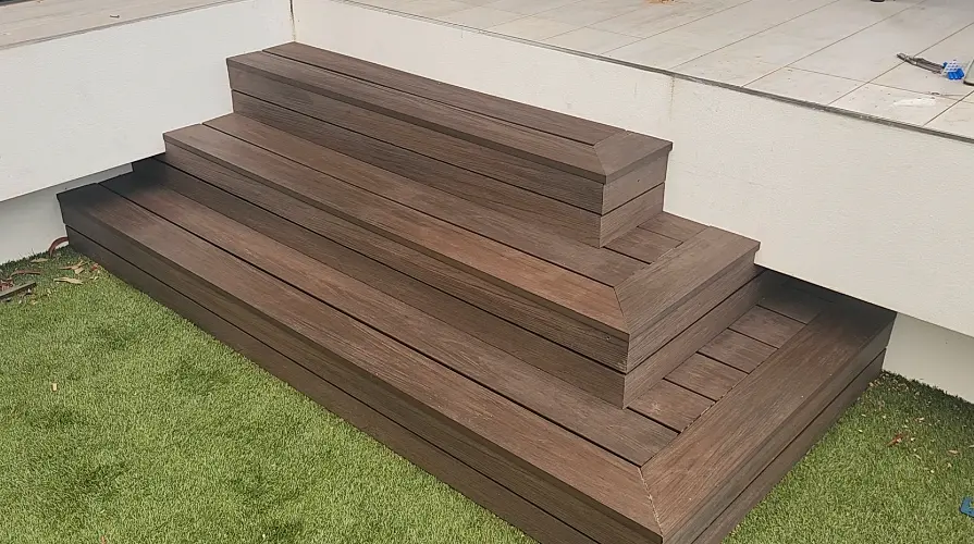 Low-set composite entry steps with mitred timber-look finish